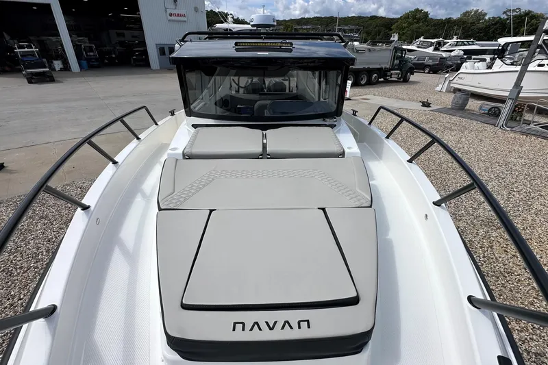 Slide: The Image of 2025 Navan C30 boat with sleek design, docked at a marina. - 48
