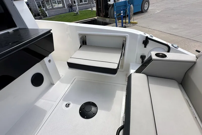 Slide: The Image of 2026 Navan C30 boat with dual Mercury engines and canopy, docked outdoors. - 6