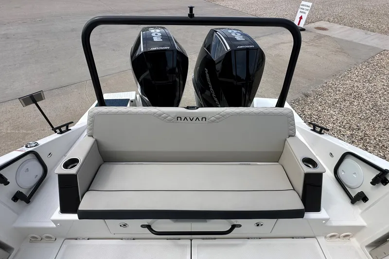 Slide: The Image of 2026 Navan C30 boat with Mercury engines, parked near a road at sunset. - 7