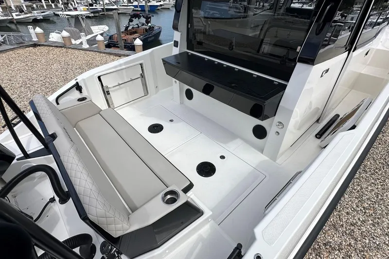 Slide: The Image of 2025 Navan C30 boat interior with foldable seating and cup holder. - 9