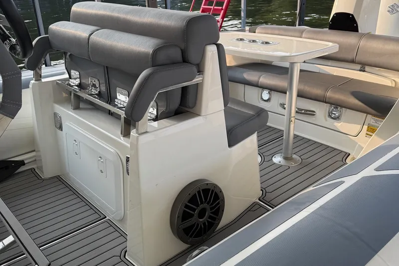 Slide: The Image of 2022 Brig Eagle 8 boat interior with seating and table, featuring modern design and comfort. - 8