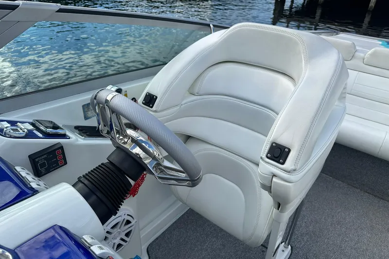 Slide: The Image of 1998 Formula 353 FASTech boat cockpit with white leather seat and steering wheel. - 15