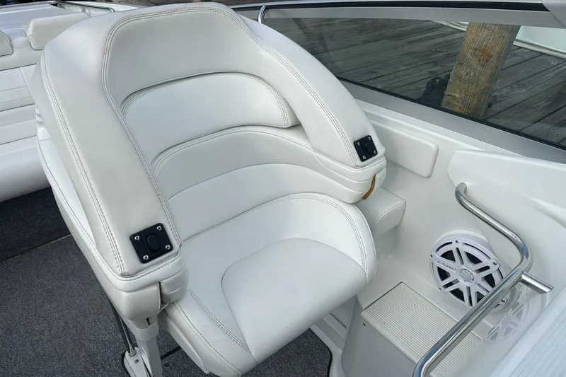 Slide: The Image of 1998 Formula 353 FASTech boat interior with white leather seating and speaker system. - 16