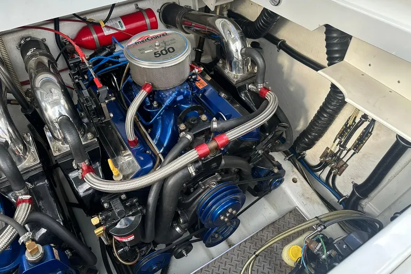 Slide: The Image of Engine compartment of a 1998 Formula 353 FASTech boat, featuring a MerCruiser 500 engine. - 20