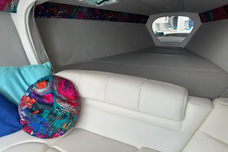 Slide: The Image of Interior of 1998 Formula 353 FASTech boat with colorful cushions and white seating. - 25