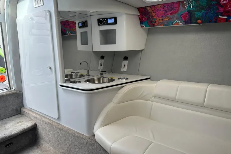 Slide: The Image of Interior of a 1998 Formula 353 FASTech boat with kitchenette and seating area. - 26