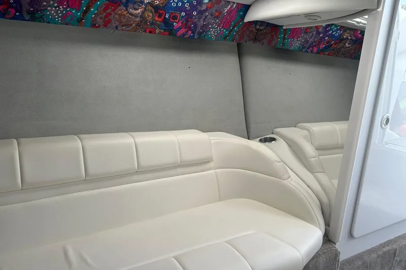 Slide: The Image of 1998 Formula 353 FASTech interior with white leather seating and colorful patterned ceiling. - 27