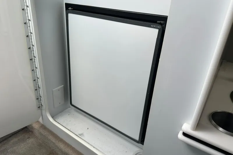 Slide: The Image of 1998 Formula 353 FASTech boat interior with Norcold refrigerator. - 28