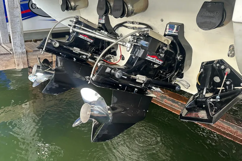 Slide: The Image of 1998 Formula 353 FASTech boat with dual MerCruiser outdrives in water. - 30