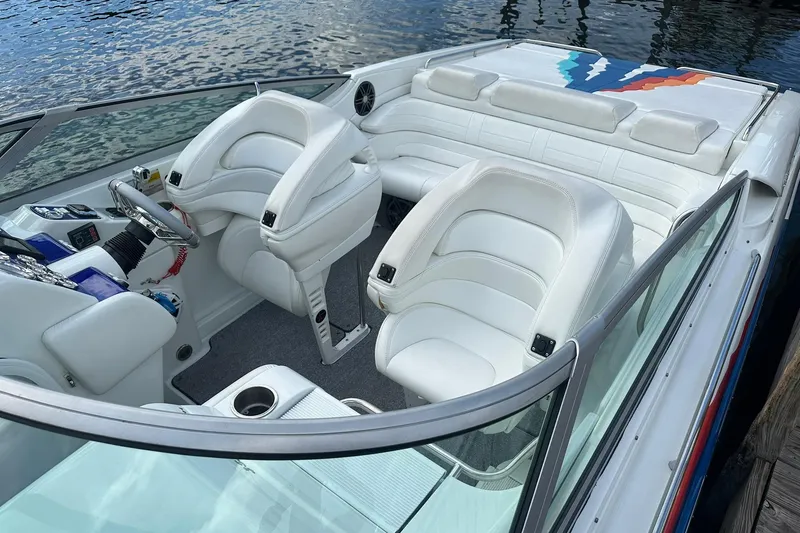 Slide: The Image of 1998 Formula 353 FASTech boat interior with white leather seats and sleek design. - 7