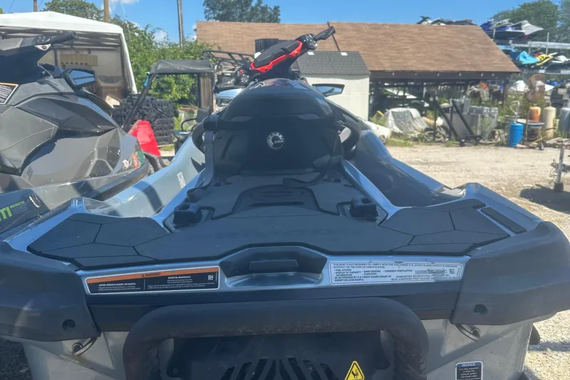 Slide: The Image of 2018 Sea-Doo RXT-X 300 jet ski parked outdoors, rear view. - 4