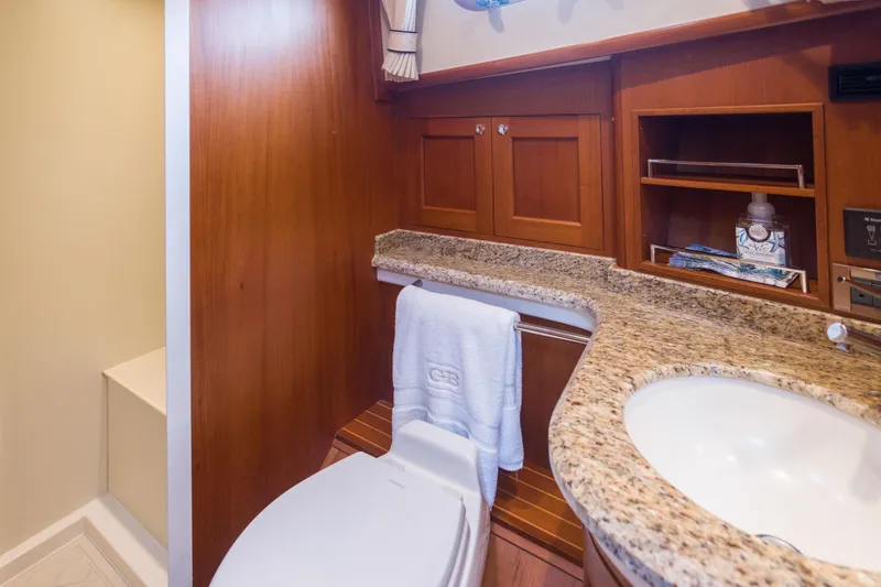 Slide: The Image of Luxurious bathroom in 2012 Grand Banks 46 Eastbay SX yacht with granite countertop. - 11