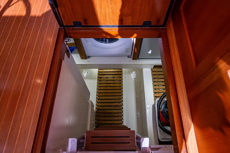 Slide: The Image of Engine room access with wooden steps on 2012 Grand Banks 46 Eastbay SX yacht. - 15
