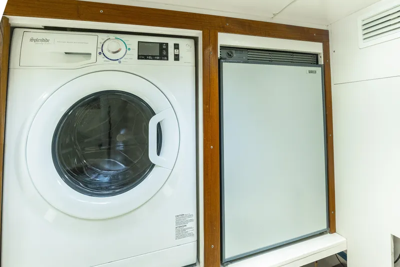 Slide: The Image of Laundry and fridge area on 2012 Grand Banks 46 Eastbay SX yacht. - 16
