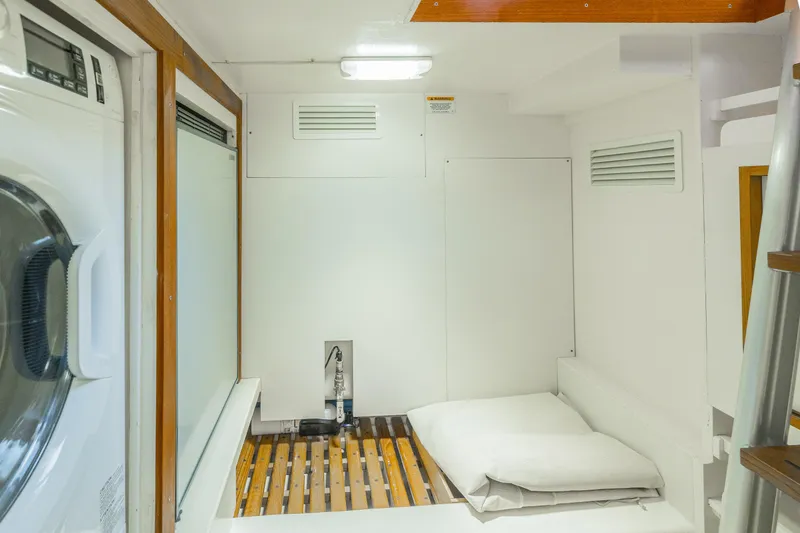 Slide: The Image of Laundry area with bed in 2012 Grand Banks 46 Eastbay SX yacht. - 17