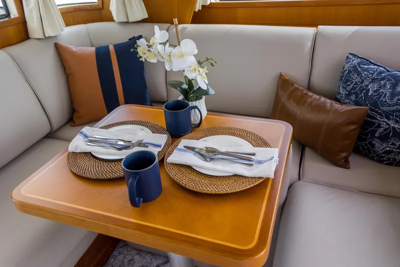 Slide: The Image of Elegant dining setup on 2012 Grand Banks 46 Eastbay SX yacht interior. - 21