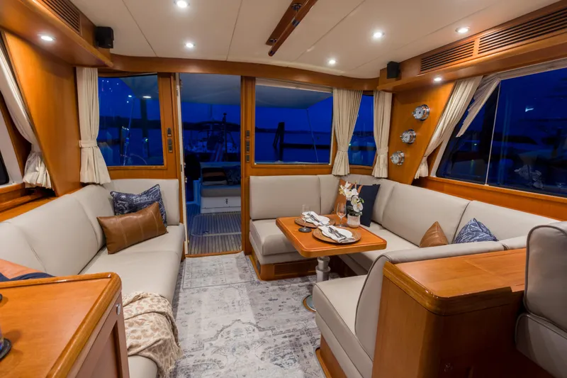 Slide: The Image of Luxurious interior of 2012 Grand Banks 46 Eastbay SX yacht with elegant seating and dining area. - 22