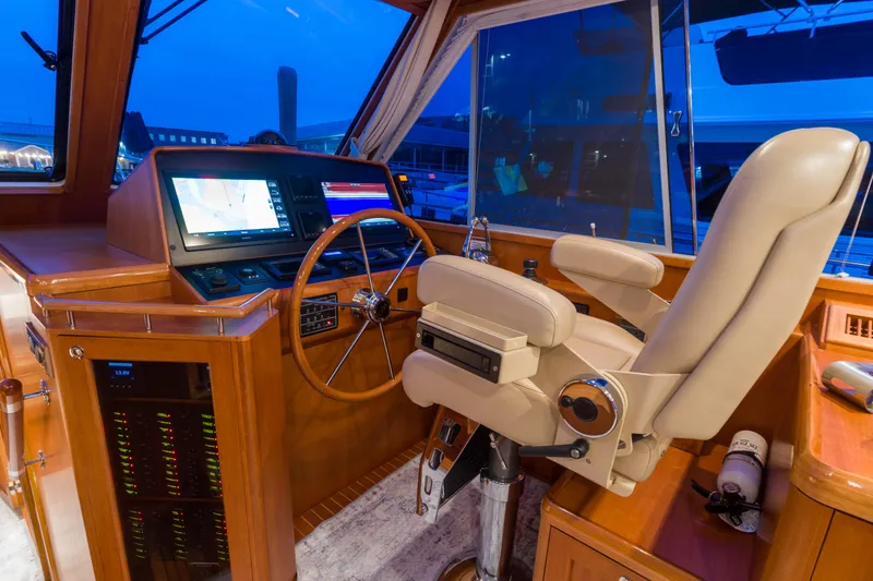 Slide: The Image of Luxurious helm of 2012 Grand Banks 46 Eastbay SX yacht with navigation equipment. - 23
