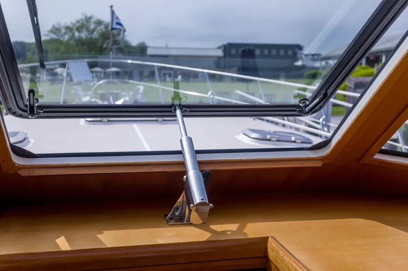 Slide: The Image of 2012 Grand Banks 46 Eastbay SX yacht interior view through open window. - 25