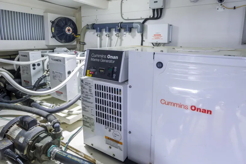 Slide: The Image of Engine room of 2012 Grand Banks 46 Eastbay SX with Cummins Onan marine generator. - 27