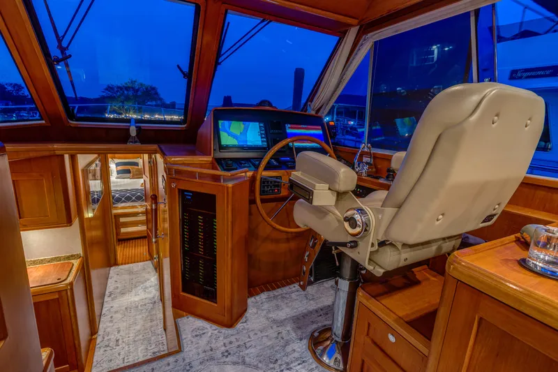 Slide: The Image of Luxurious 2012 Grand Banks 46 Eastbay SX yacht interior with navigation station and captain's chair. - 3