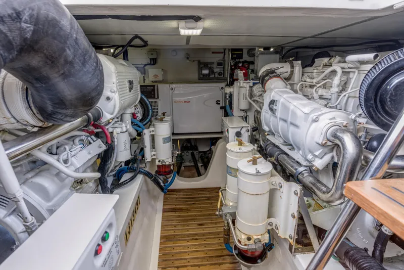 Slide: The Image of Engine room of 2012 Grand Banks 46 Eastbay SX yacht, showcasing mechanical components. - 30