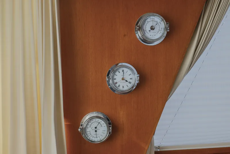 Slide: The Image of Nautical instruments on Grand Banks 46 Eastbay SX, 2012 model, wooden panel background. - 40