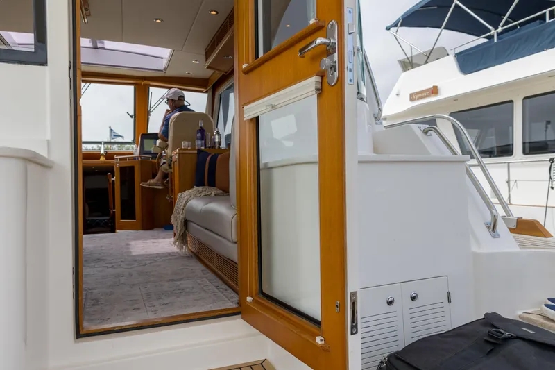 Slide: The Image of Interior view of 2012 Grand Banks 46 Eastbay SX yacht, featuring elegant wood finishes. - 41