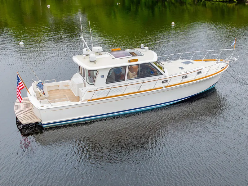 Slide: The Image of 2012 Grand Banks 46 Eastbay SX yacht on calm water, side view. - 48
