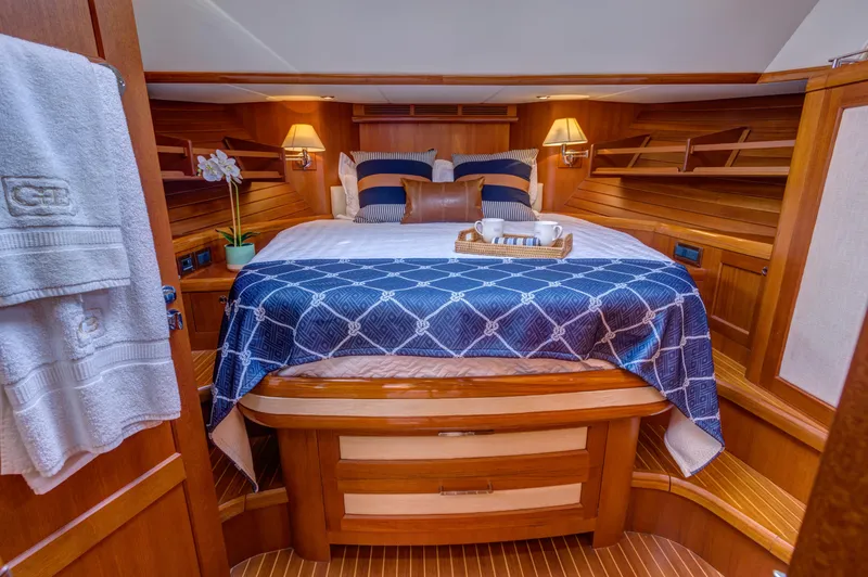 Slide: The Image of Luxurious cabin interior of 2012 Grand Banks 46 Eastbay SX yacht with elegant bedding. - 5