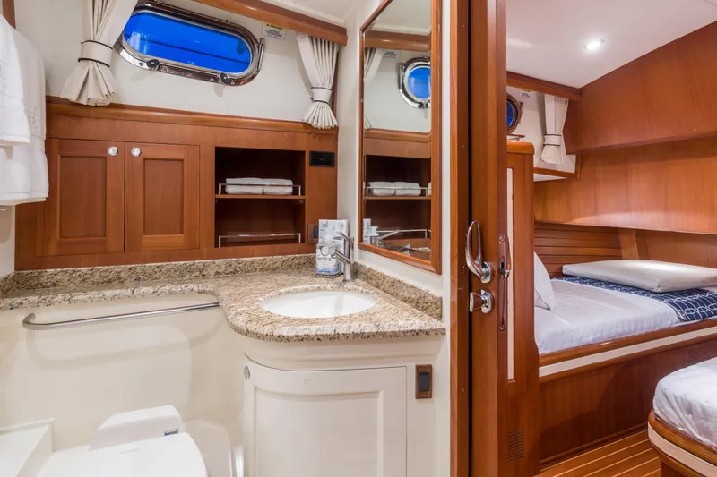 Slide: The Image of Luxurious 2012 Grand Banks 46 Eastbay SX yacht interior with elegant wood finishes and modern amenities. - 9