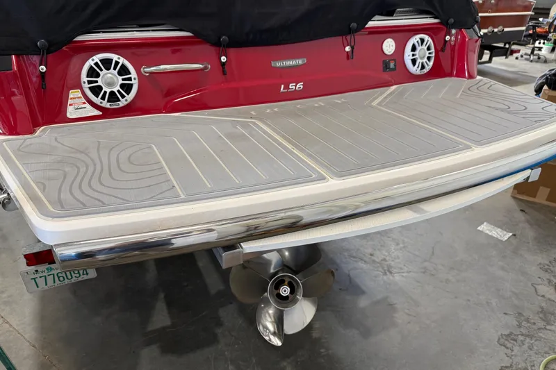 Slide: The Image of 2024 Regal LS6 boat rear view with speakers and swim platform. - 10