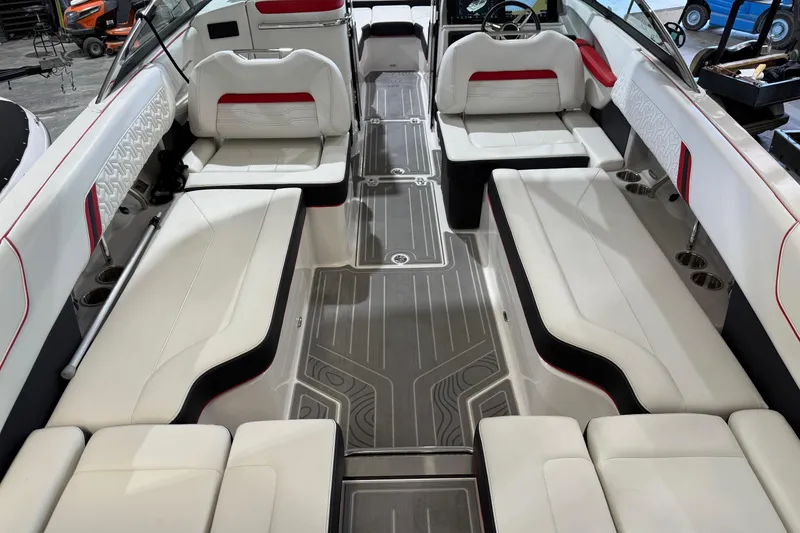 Slide: The Image of 2024 Regal LS6 boat interior with white seating and modern design. - 12
