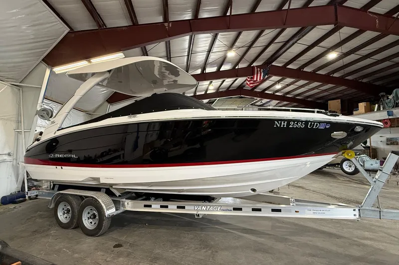 Slide: The Image of 2024 Regal LS6 boat on trailer in indoor storage facility. - 14