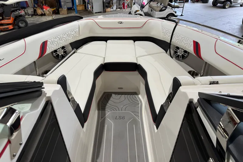 Slide: The Image of 2024 Regal LS6 boat interior with luxurious white seating and modern design. - 5