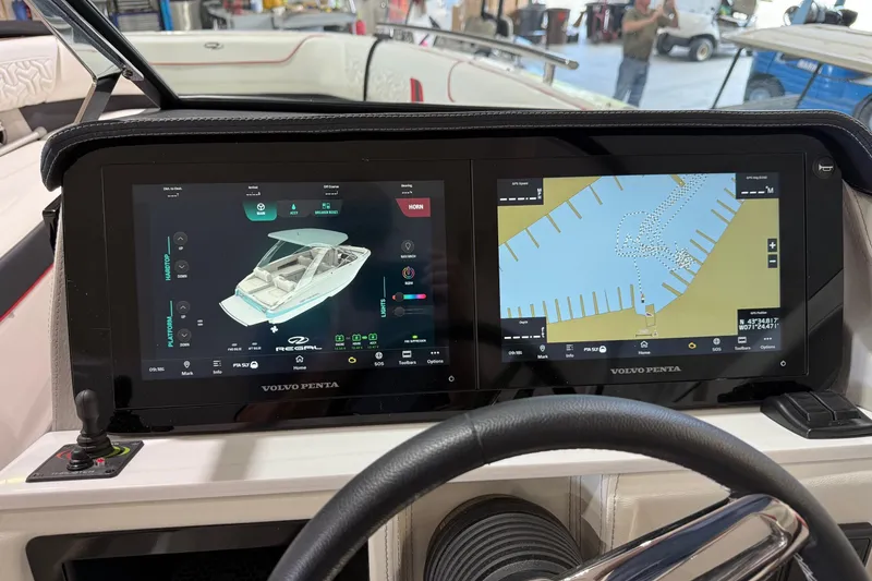 Slide: The Image of 2024 Regal LS6 boat dashboard with dual Volvo Penta displays showing navigation and system controls. - 8
