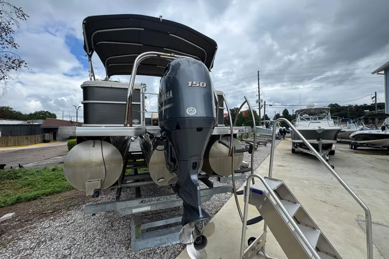 Slide: The Image of 2017 Sweetwater Premium Edition 255 SL pontoon boat with Yamaha 150 engine on trailer. - 11