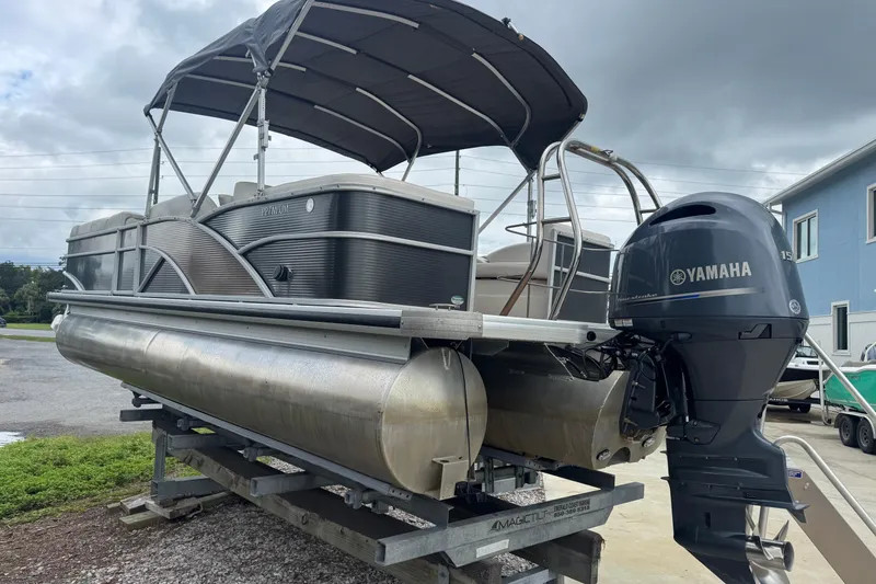 Slide: The Image of 2017 Sweetwater Premium Edition 255 SL pontoon boat with Yamaha outboard motor on trailer. - 8