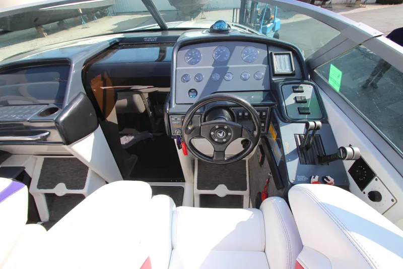 Slide: The Image of Interior of a 1995 Formula SR1 303 boat with steering wheel and dashboard controls. - 12