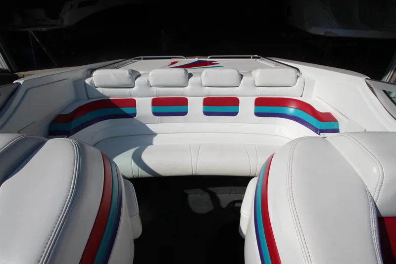 Slide: The Image of Interior of 1995 Formula SR1 303 boat with white and multicolored seating. - 16