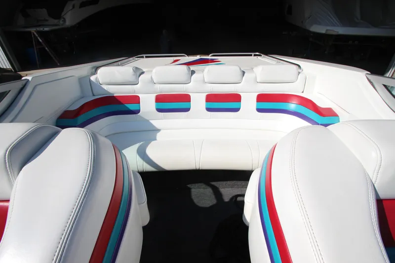 Slide: The Image of Interior of 1995 Formula SR1 303 boat with colorful striped seating. - 17