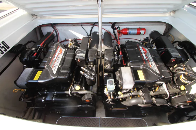 Slide: The Image of Twin engines in a 1995 Formula SR1 303 boat, open engine compartment view. - 28