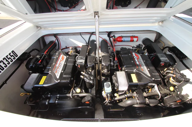 Slide: The Image of Twin engines in a 1995 Formula SR1 303 boat engine compartment. - 29