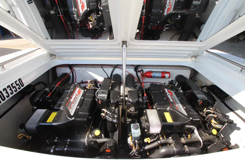 Slide: The Image of 1995 Formula SR1 303 engine compartment with dual engines and fire extinguisher. - 32