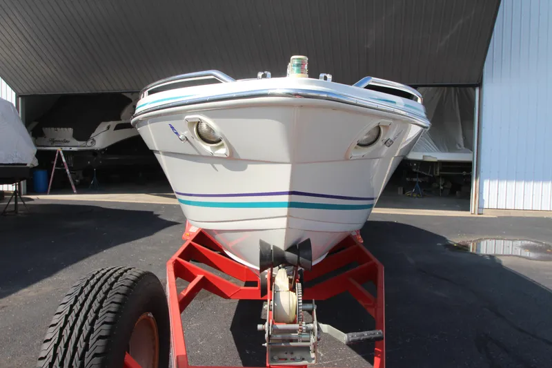 Slide: The Image of 1995 Formula SR1 303 boat on trailer in storage facility. - 6