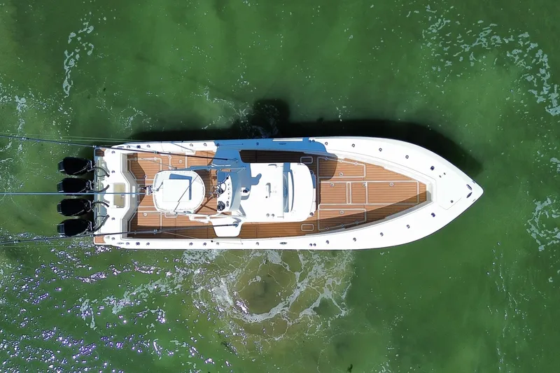 Slide: The Image of Overhead view of 2018 SeaVee 390Z boat on green water. - 21