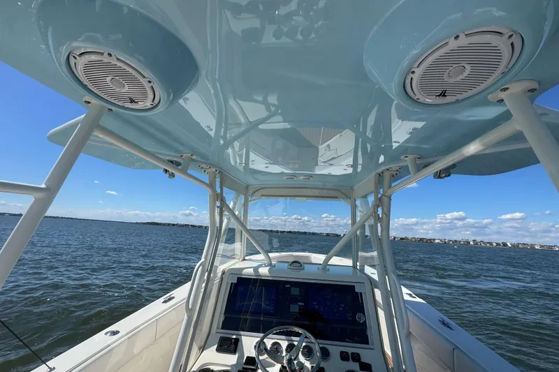 Slide: The Image of 2018 SeaVee 390Z boat interior with navigation system, speakers, and ocean view. - 24