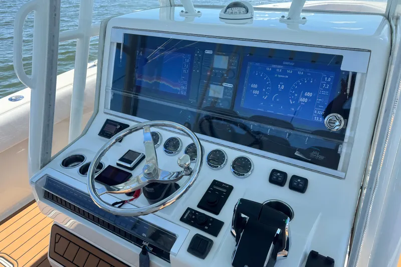 Slide: The Image of Control panel of a 2018 SeaVee 390Z boat with advanced navigation displays. - 25