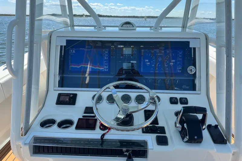 Slide: The Image of 2018 SeaVee 390Z boat dashboard with advanced navigation and control systems. - 26
