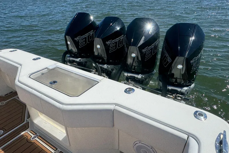 Slide: The Image of 2018 SeaVee 390Z boat with four powerful outboard engines on the water. - 33